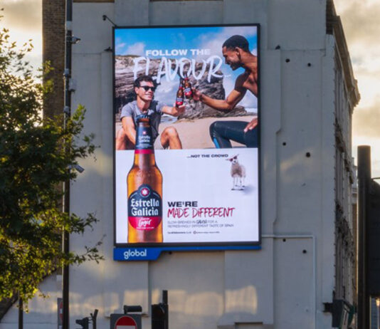 Estrella Galicia launches UK campaign and new format to build on growth An electronic billboard on the side of a building has the winter 2025 campaign for Estrella Galicia on it.