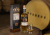 Glasgow 1770 whisky unveils Bourbon Cask Single Malt to core range A bottle of Glasgow 1770 Bourbon Cask Matured Single Malt stands on whisky barrel with the outer packaging next to it and a nosing glass with the whisky inside on its other side. There is also a barrel in the background labelled as Bourbon.