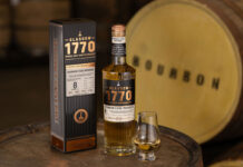 Glasgow 1770 whisky unveils Bourbon Cask Single Malt to core range A bottle of Glasgow 1770 Bourbon Cask Matured Single Malt stands on whisky barrel with the outer packaging next to it and a nosing glass with the whisky inside on its other side. There is also a barrel in the background labelled as Bourbon.
