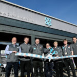 Irvine Co-op reopens its doors following refit Staff at the Co-op Caldon Road Store stand in front of the shop with a novelty pair of scissors and ribbon to mark the completion of its refit.