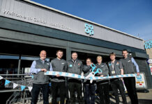Irvine Co-op reopens its doors following refit Staff at the Co-op Caldon Road Store stand in front of the shop with a novelty pair of scissors and ribbon to mark the completion of its refit.