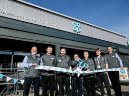 Irvine Co-op reopens its doors following refit Staff at the Co-op Caldon Road Store stand in front of the shop with a novelty pair of scissors and ribbon to mark the completion of its refit.