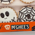 McGhee’s brings a spooky touch to its Empire Biscuits with a new Halloween design Pack shot of McGhee's Halloween Empire Biscuits with skull and spiderweb designs on them.