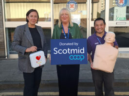 Scotmid Co-op makes a life-saving donation to St Andrew’s First Aid Lynne Ogg, head of membership & community engagement at Scotmid, stands holding a first aid kit next to Moyra Reid, head of marketing, communications and fundraising at St Andrew's First Aid and Daniel Handy. Moyra holds a placard with the Scotmid Co-op logo on it and Daniel holds a dummy used to perform CPR on.