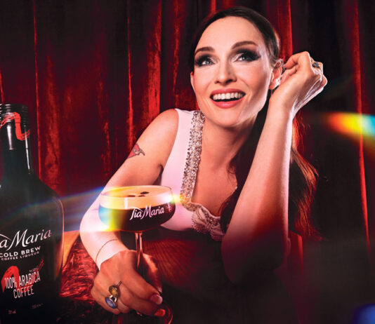 Sophie Ellis Bextor teams up with Tia Maria for new on-pack promo Sophie Ellis Bextor sits at a table holding an Espresso Martini cocktail in a Tia Maria branded glass. There is also a bottle of Tia Maria on the table.