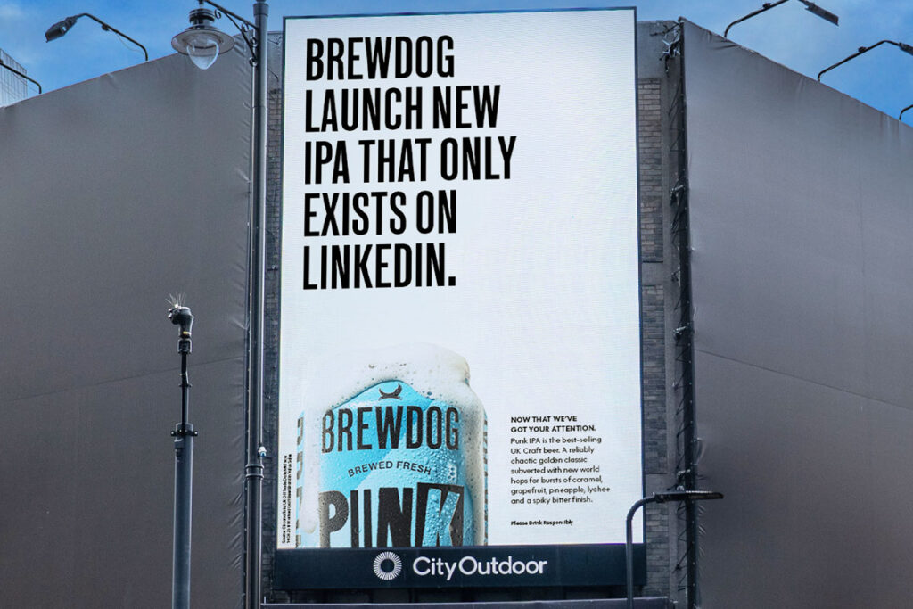 A digital billboard with the 2025 BrewDog campaign 'What Have BrewDog Done Now?'.