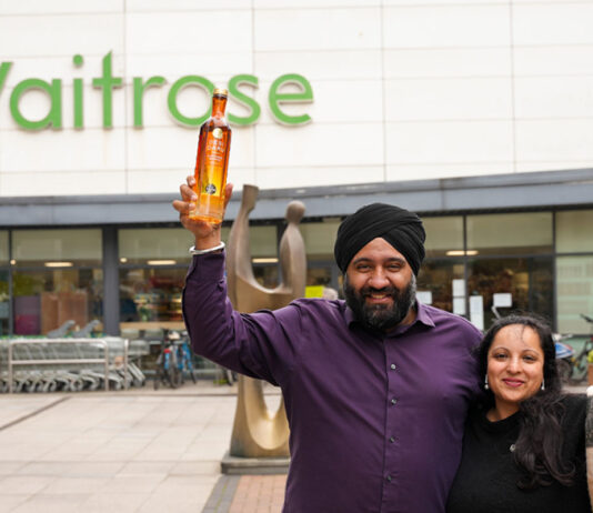 Desi Daru vodka makes its Waitrose debut with Mango Vodka variant Desi Daru founders Mohit Singh and Aneet Kaur stand outside a Waitrose store holding bottles of Desi Daru Mango Vodka.