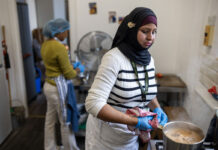 Don’t let good food go to waste A person stands in a kitchen cooking food in a pot.