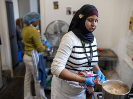 Don’t let good food go to waste A person stands in a kitchen cooking food in a pot.