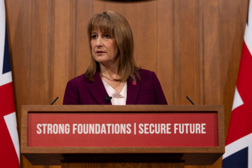 Rachel Reeves stands at a podium in parliament.