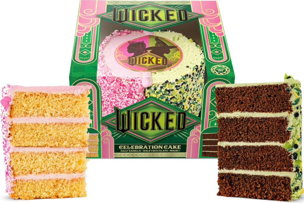 A pack shot of the Wicked Celebration Cake with slices of the cake cut out on either side of the box.