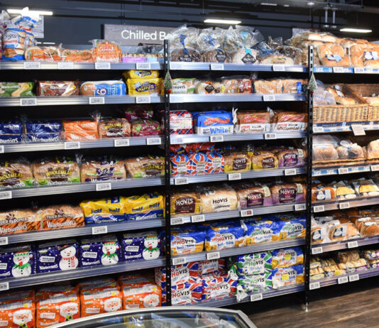Inflation falls to lowest rate in eight months A bread and bakery section inside of a convenience store.