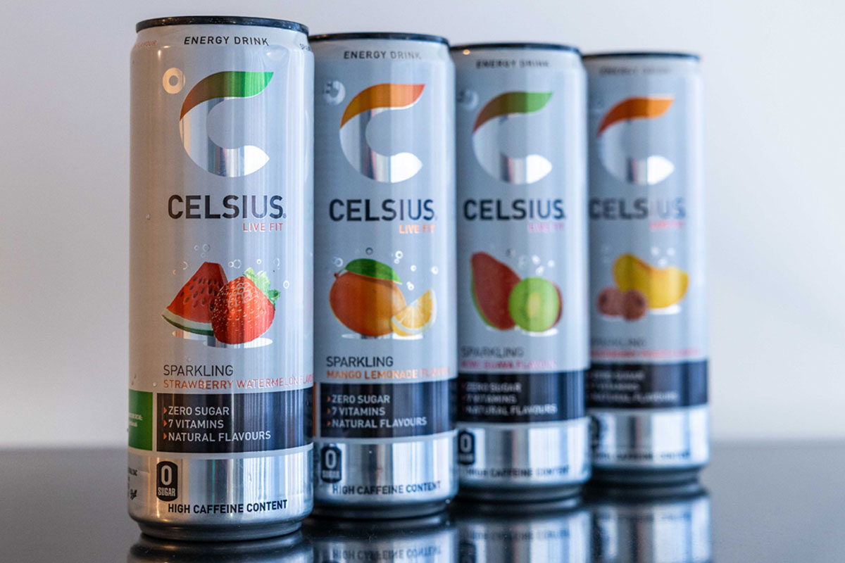 Four cans of Celsius Energy drinks stand in a row.