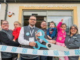 Co-op opens four new stores across Scotland A group of people open Co-op Selkirk using novelty scissors to cut a Co-op branded ribbon.