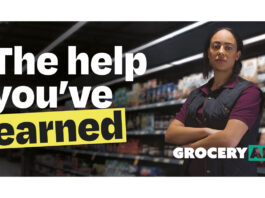 GroceryAid unveils its biggest brand refresh in 168 years A woman stands with her arms folded in the middle of a shop with the GroceryAid logo in front of her. The text to the left reads "The help you've earned".