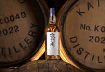 Hatozaki Japanese whisky launches Triple Cask Reserve dram A bottle of Hatozaki Whisky Triple Cask Reserve is balanced on a wooden cask with wooden casks behind this.