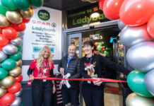 Spar Market Ladybank opens its doors following major investment A group of people stand at the entrance to Spar Market Ladybank whilst cutting a ribbon with a novelty pair of scissors.