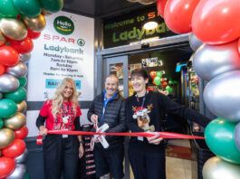 Spar Market Ladybank opens its doors following major investment A group of people stand at the entrance to Spar Market Ladybank whilst cutting a ribbon with a novelty pair of scissors.