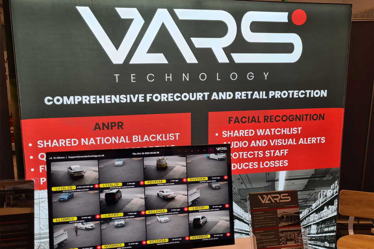 A VARS Technology stands with its signage behind a table that has a computer screen showing examples of drive-offs happening at forecourt stations.