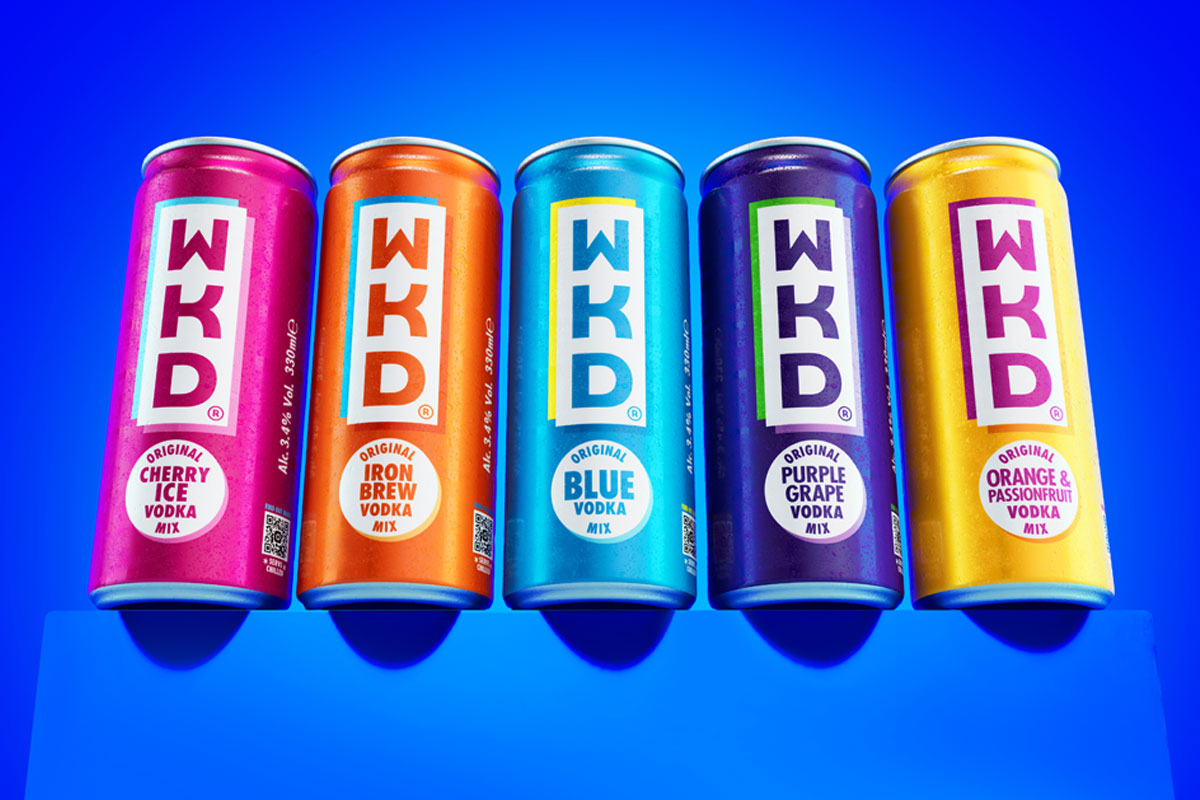 Cans of WKD are lined up against a blue background including Cherry Ice, Iron Brew, Blue, Purple Grape and Orange & Passionfruit.