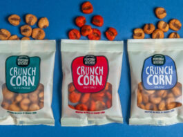 Popcorn Kitchen goes savoury with new Crunch Corn Pack of Popcorn Kitchen Crunch Corn lay open on a blue background with pieces of the corn spilled out from the top of the packs.