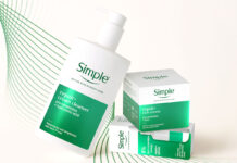 Simple drives premium skincare solution in new range A bottle of Simple Repair+ Cream Cleanser leans on packs of Simple Repair+ Rich Cream and Simple Repair+ Serum against a white background with green design elements.