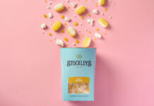 Stockley’s takes on a dessert classic with Lemon Meringue sweets A pack of Stockley's Lemon Meringue hard-bolied sweets is tipped out over a pink background with the sweets spilling out.