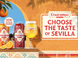 Cruzcampo introduces Sevilla Orange beer flavour Promotional image of Cruzcampo Sevilla Orange launch featuring a can of the new beer and classic Cruzcampo sitting on a windowsill on a wall.