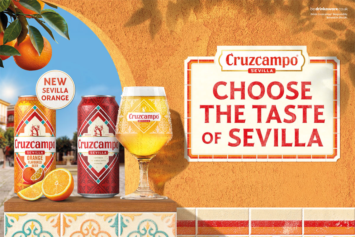 Promotional image of Cruzcampo Sevilla Orange launch featuring a can of the new beer and classic Cruzcampo sitting on a windowsill on a wall.