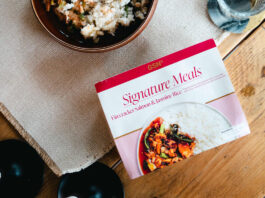 GSN expands its Signature ready meal range A pack of GSN Signature Meal Firecracker Salmon & Jasmine Rice sits on a table with the meal plated up next to it.