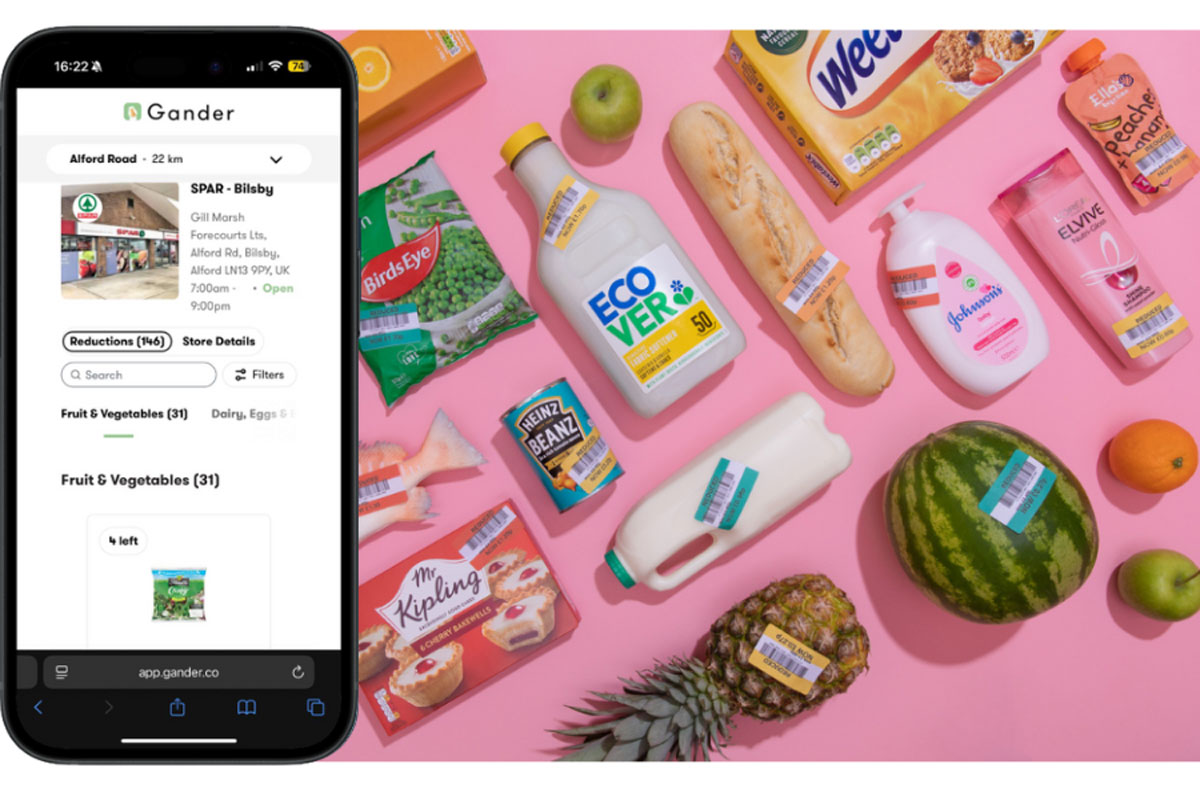 An iPhone shows the Gander app on its screen next to a range of products with reduced price labels across them.
