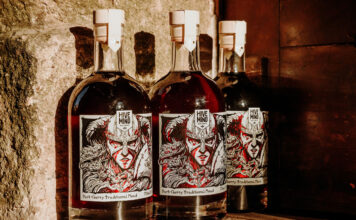 Hive Mind rolls out Dark Cherry Mead for young adults Bottles of Hive Mind Dark Cherry Mead are lined up against a wall.