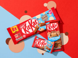 KitKat introduces new Cookie Dough flavour across range Packs of KitKat Cookie Dough formats sit across a red and blue background with beige and brown coloured dots as part of the background design.