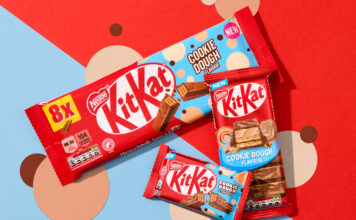 KitKat introduces new Cookie Dough flavour across range Packs of KitKat Cookie Dough formats sit across a red and blue background with beige and brown coloured dots as part of the background design.
