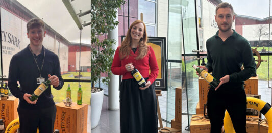 LMB UK strengthens team with new hires Team members from LMB UK hold bottles of Cutty Sark in the company's offices.