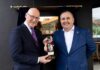 First Minister opens Luss Distillery First Minister John Swinney receives a bespoke bottle of whisky from Loch Lomond Group chief executive Colin Matthews.