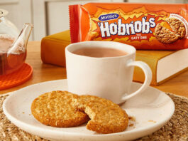 McVitie’s and PG Tips take a tea break A plate with a cup of tea and HobNob biscuits on it are in the foreground with a packet of McVitie's Hobnobs in the background and a glass teapot next to the plate.