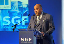 Violence against staff rises in SGF report Pete Cheema, chief executive at SGF, stands at a podium giving a speech.
