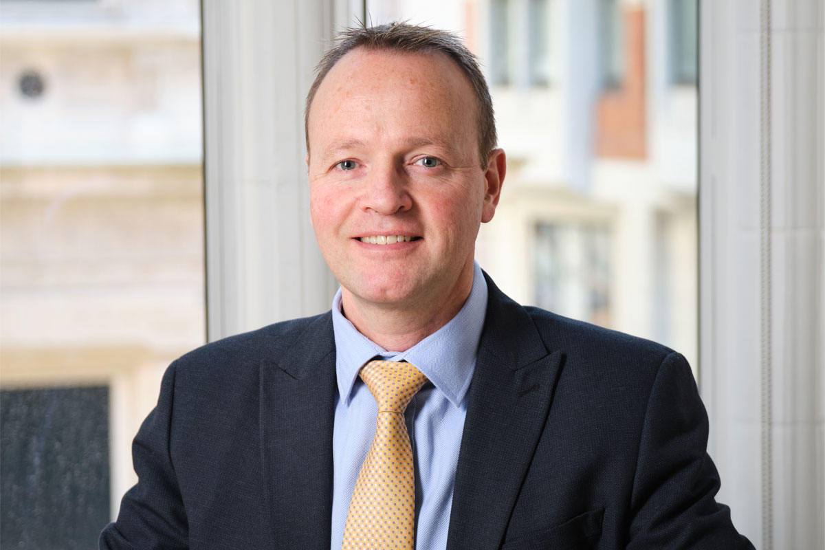 Steve Rodell, managing director – retail & leisue at Christie & Co, sits at a desk.