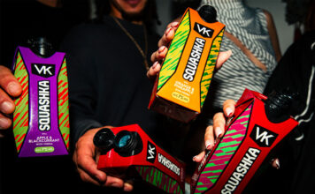 VK Squashka range debuts in Scotmid stores A group of people hold bottles of VK Squashka up to the camera.