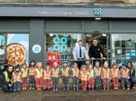 Co-op store reopens in Tarbert A group of kids are lined up outside Co-op Tarbert to mark the store's reopening.