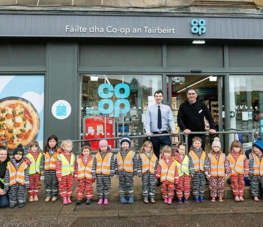 Co-op store reopens in Tarbert A group of kids are lined up outside Co-op Tarbert to mark the store's reopening.
