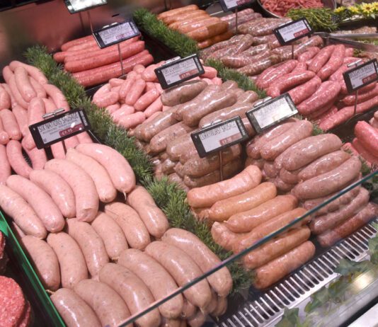 Food and drink sector builds on economic growth A butchery counter featuring a range of meat products including burgers and sausages.