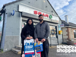 Retail Game Changers: Snappy Shopper Asiyah and Jawad Javed, store owners of Spar Alloa Road, stand outside their store with the Snappy Shopper logo in the bottom right corner.