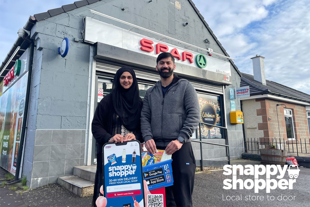 Asiyah and Jawad Javed, store owners of Spar Alloa Road, stand outside their store with the Snappy Shopper logo in the bottom right corner.