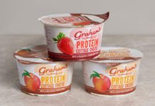 Graham’s introduces new Cottage Cheese with Fruit Layers Pots of Graham's The Family Dairy's Cottage Cheese with Fruit Layers have been stacked up in a pyramid formation against a grey background.