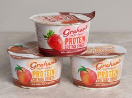 Graham’s introduces new Cottage Cheese with Fruit Layers Pots of Graham's The Family Dairy's Cottage Cheese with Fruit Layers have been stacked up in a pyramid formation against a grey background.