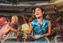 CCEP rolls out first on-pack promo for Jack Daniel’s & Coca-Cola A group of people are partying at Wembley Stadium in London holding cans of Jack Daniel's & Coca-Cola.