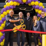 Jet Restalrig reopens following six-month transformation A group of people open Jet Restalrig in Edinburgh using a pair of novelty scissors to cut a ribbon.
