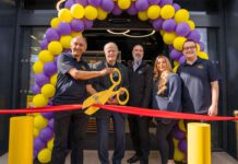 Jet Restalrig reopens following six-month transformation A group of people open Jet Restalrig in Edinburgh using a pair of novelty scissors to cut a ribbon.